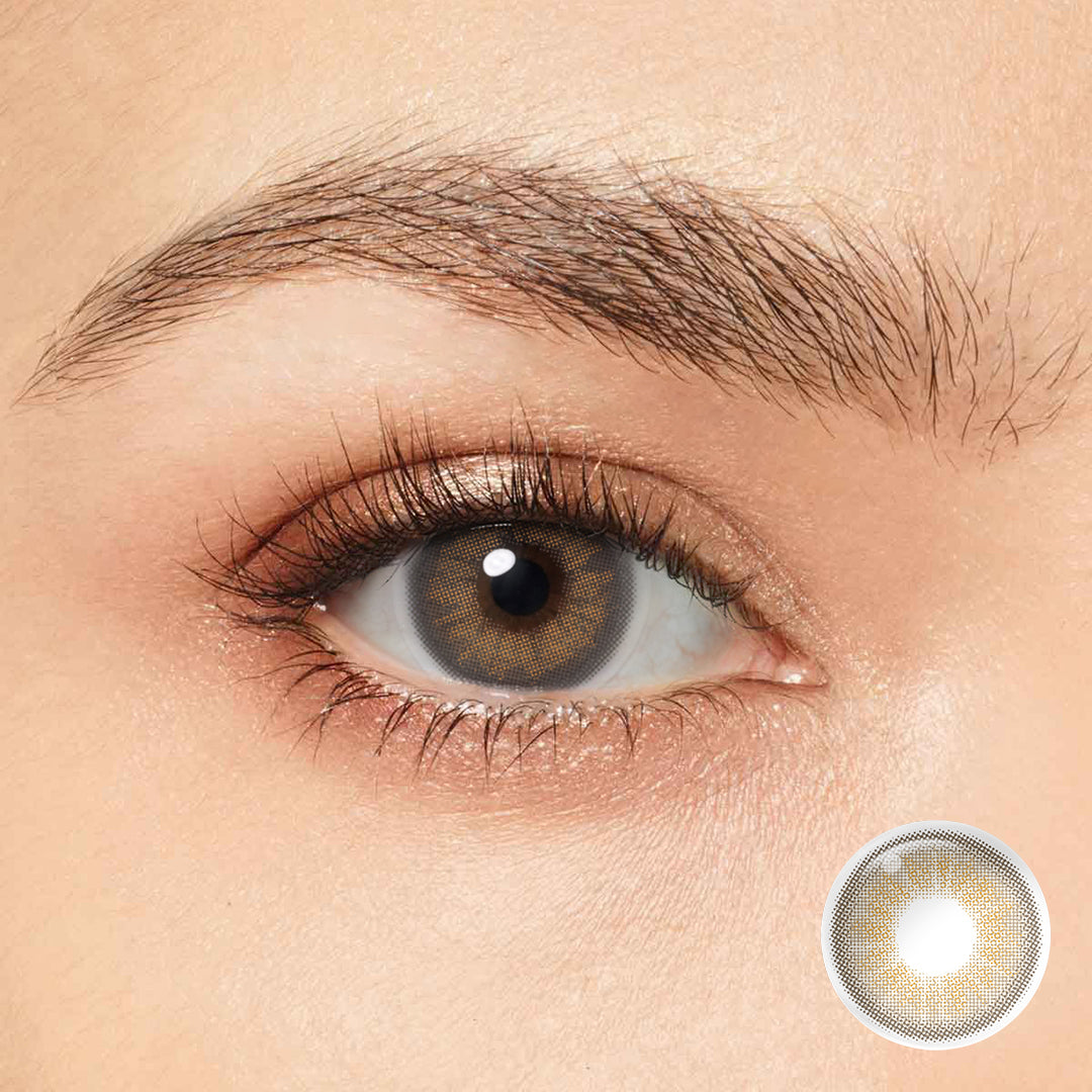 Enhance your natural beauty with Magister Desire II Amber Gray Colored Contacts. The delicate limbal ring enhances depth while seamlessly blending with your eye color for a captivating look.
