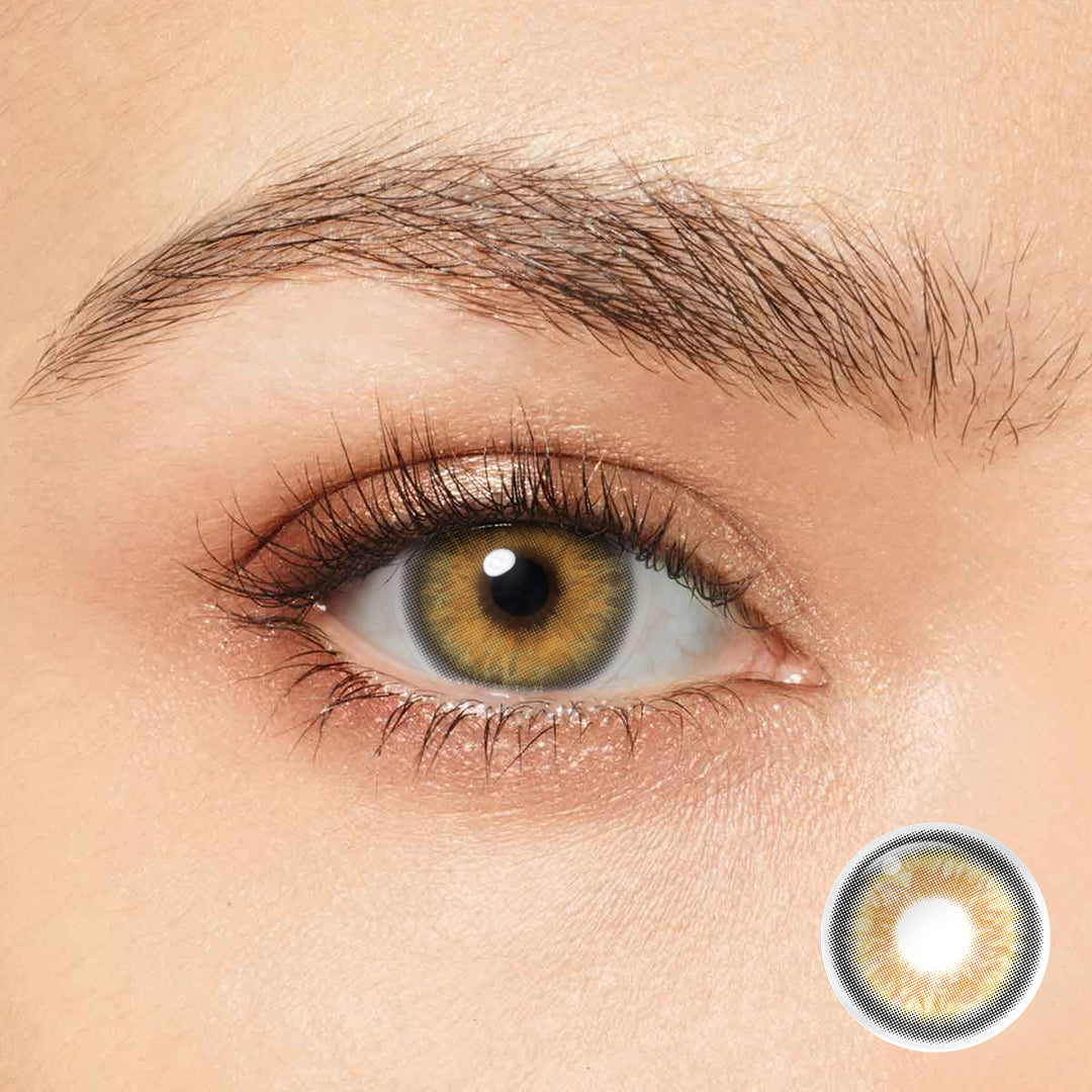 Enhance your natural beauty with Magister Iris Vanilla Brown Colored Contacts. These contacts feature a smooth outer ring and a unique sun-shaped inner ring.