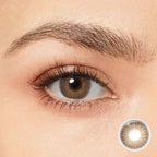 Elevate your look with Magister OMG Brown Colored Contacts. These premium lenses boast a medium monochromatic shade that seamlessly blends with your natural eye color, creating a sophisticated and alluring appearance. 