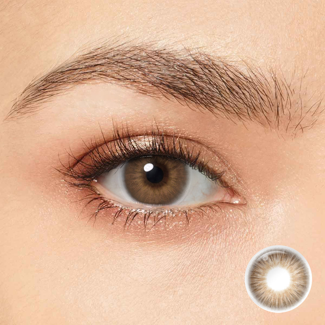 Elevate your look with Magister OMG Brown Colored Contacts. These premium lenses boast a medium monochromatic shade that seamlessly blends with your natural eye color, creating a sophisticated and alluring appearance. 